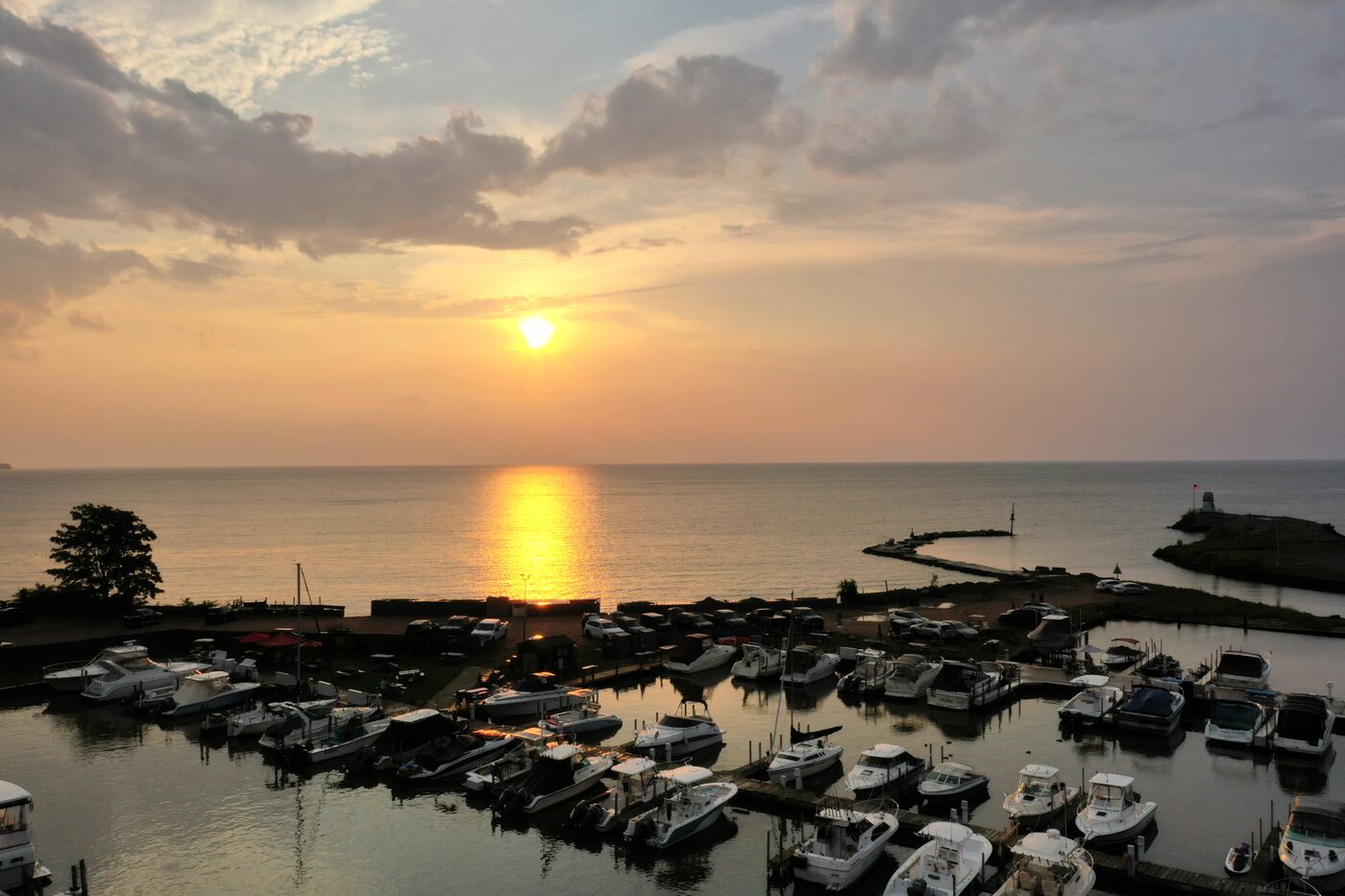 Boats tied up in the harbour at sunset